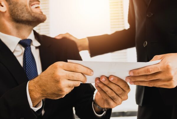 boss sharing bonus check with employee