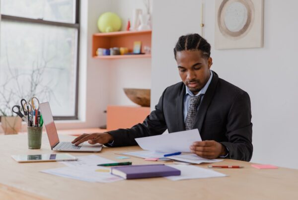 Man at desk planning taxes