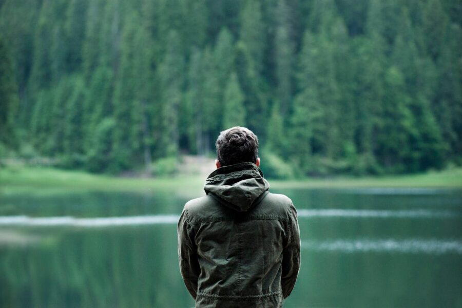 Man in front of body of water