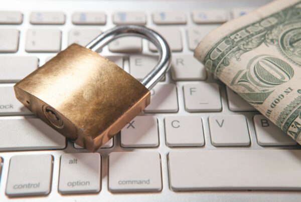 A lock and money on a keyboard