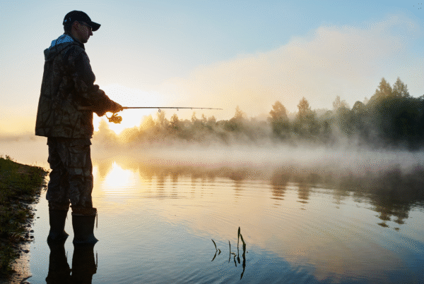 Man fishing thinking about solo retirement.