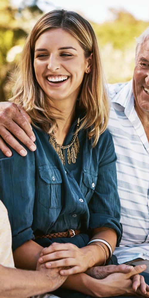 Adult daughter sitting with parents discussing estate planning with adult children